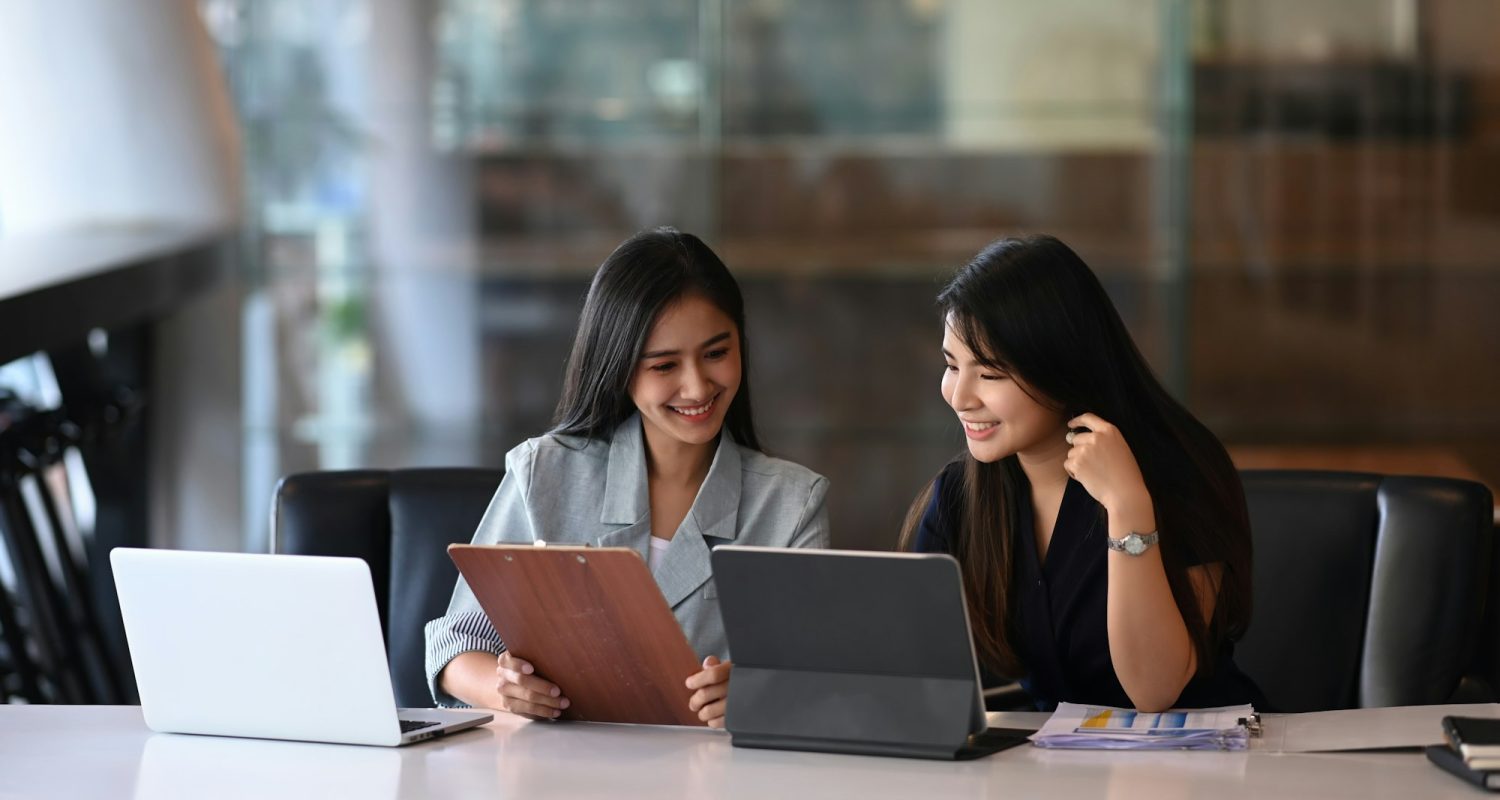 Two young businesswoman discussing new creative concept for the new product marketing promotion.